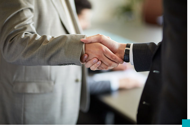 a close-up of a man shaking hands